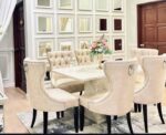 Create an inviting and sophisticated dining experience with the GoodLuck Series Premium 6 Seater Dining Set. Featuring a luxurious cream marble table, this elegant dining room showcases a beautiful floral centerpiece, mirrored wall panels, and stylish modern décor—perfect for both family dinners and entertaining guests. Upgrade your home with this high-quality 6 seater marble dining set for timeless style and comfort.
