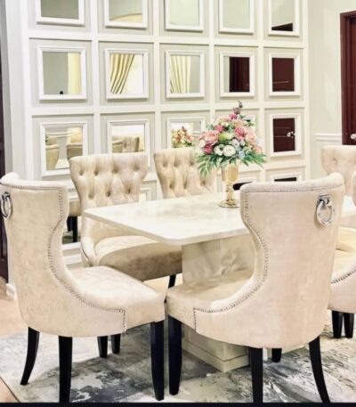 Create an inviting and sophisticated dining experience with the GoodLuck Series Premium 6 Seater Dining Set. Featuring a luxurious cream marble table, this elegant dining room showcases a beautiful floral centerpiece, mirrored wall panels, and stylish modern décor—perfect for both family dinners and entertaining guests. Upgrade your home with this high-quality 6 seater marble dining set for timeless style and comfort.