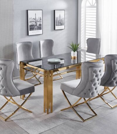Transform your dining space with the Dove Series IX Premium Stainless Steel 6 Seater Dining Set. Featuring a sleek glass table with elegant gold metal legs and plush gray tufted chairs, this modern dining room set adds a touch of luxury to any home. Gray walls adorned with stylish framed photos create a sophisticated backdrop, while a lush plant centerpiece brings freshness and life to the table. Upgrade your dining room décor today with this contemporary, eye-catching furniture ensemble designed for both style and comfort.