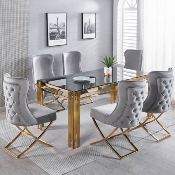 Transform your dining space with the Dove Series IX Premium Stainless Steel 6 Seater Dining Set. Featuring a sleek glass table with elegant gold metal legs and plush gray tufted chairs, this modern dining room set adds a touch of luxury to any home. Gray walls adorned with stylish framed photos create a sophisticated backdrop, while a lush plant centerpiece brings freshness and life to the table. Upgrade your dining room décor today with this contemporary, eye-catching furniture ensemble designed for both style and comfort.